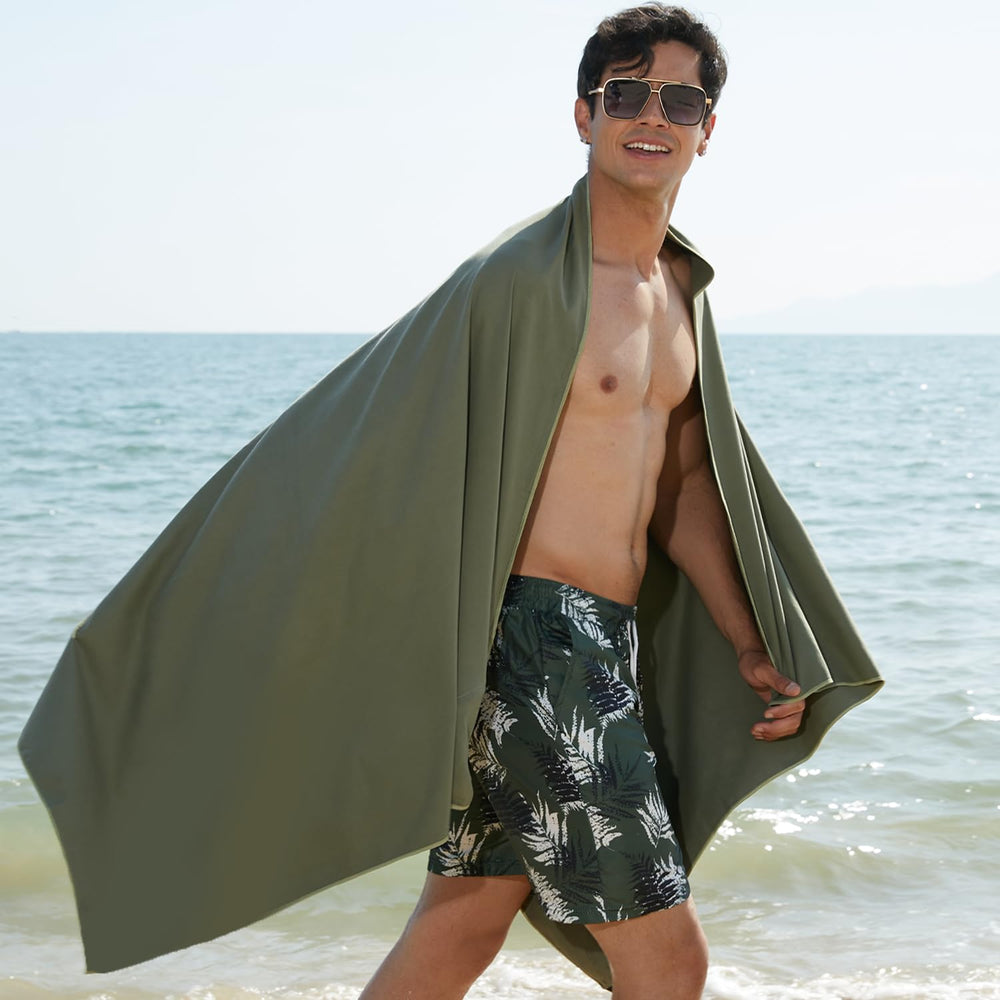 Rainleaf towel on sandy beach showing sand-resistant benefit for outdoor use