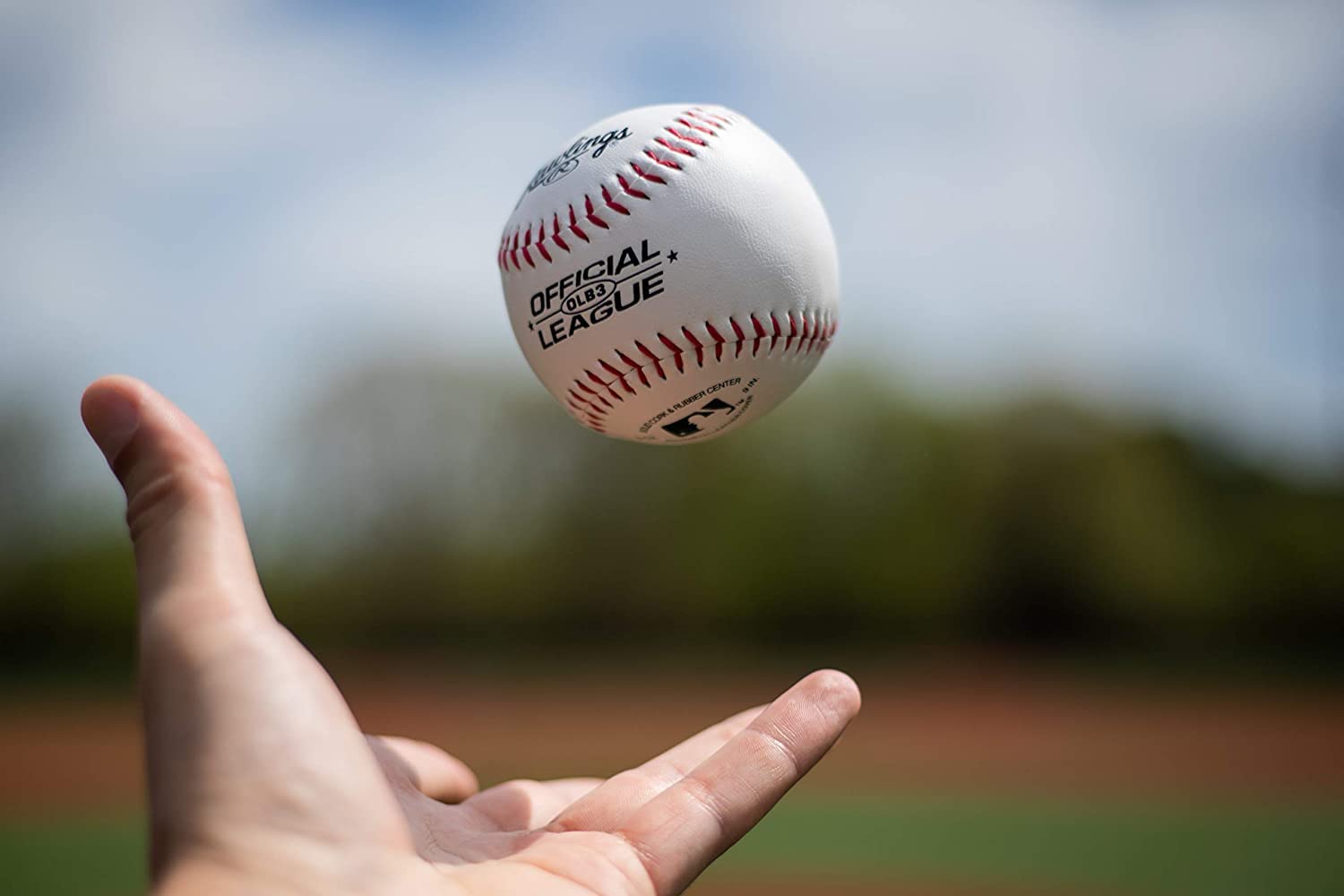 Rawlings comparación de tamaño en mano, tamaño oficial