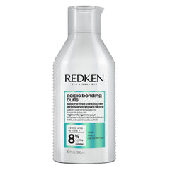 Redken frasco frontal del acondicionador mostrando marca y formato 300 ml