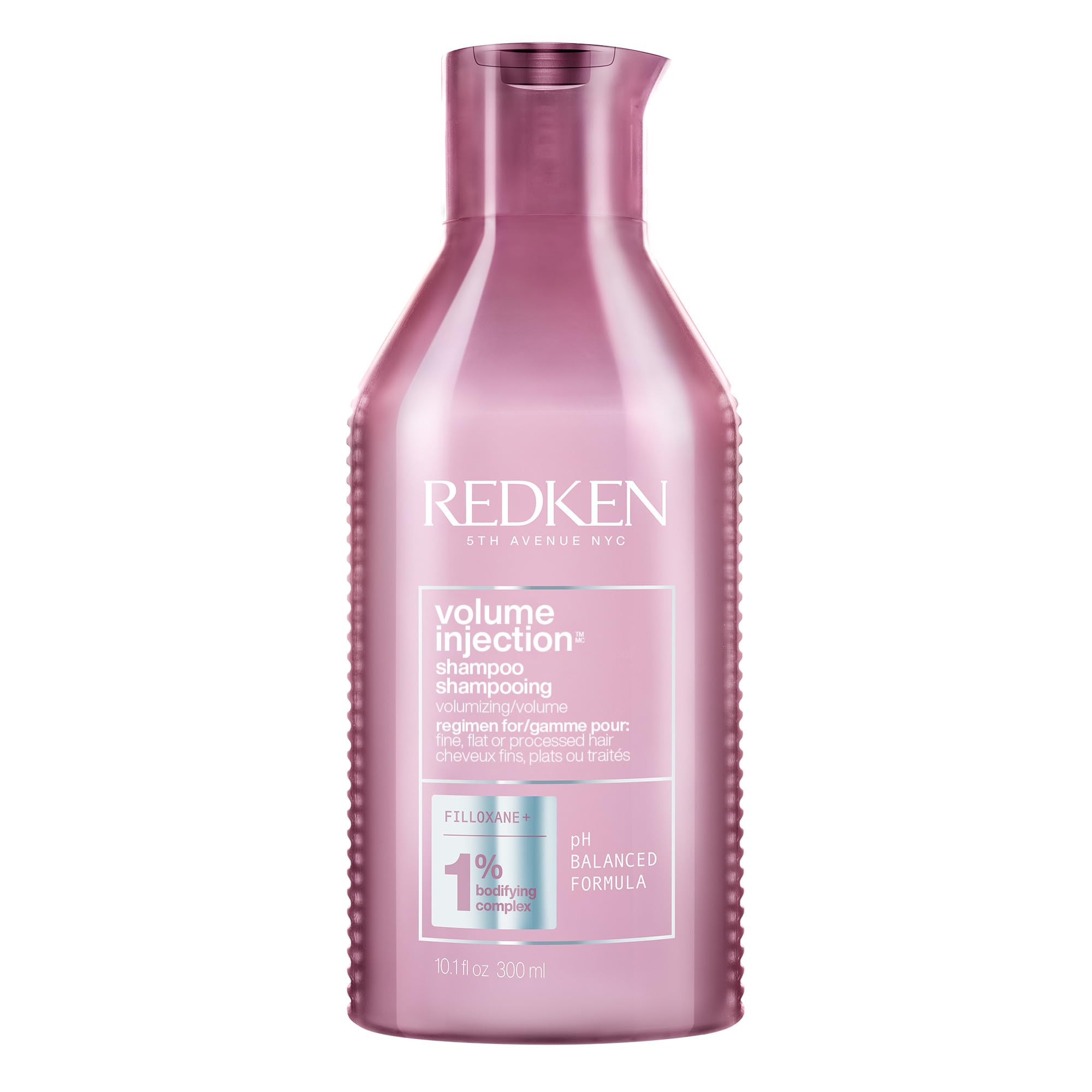 Redken champú frente del envase mostrando diseño profesional y volumen