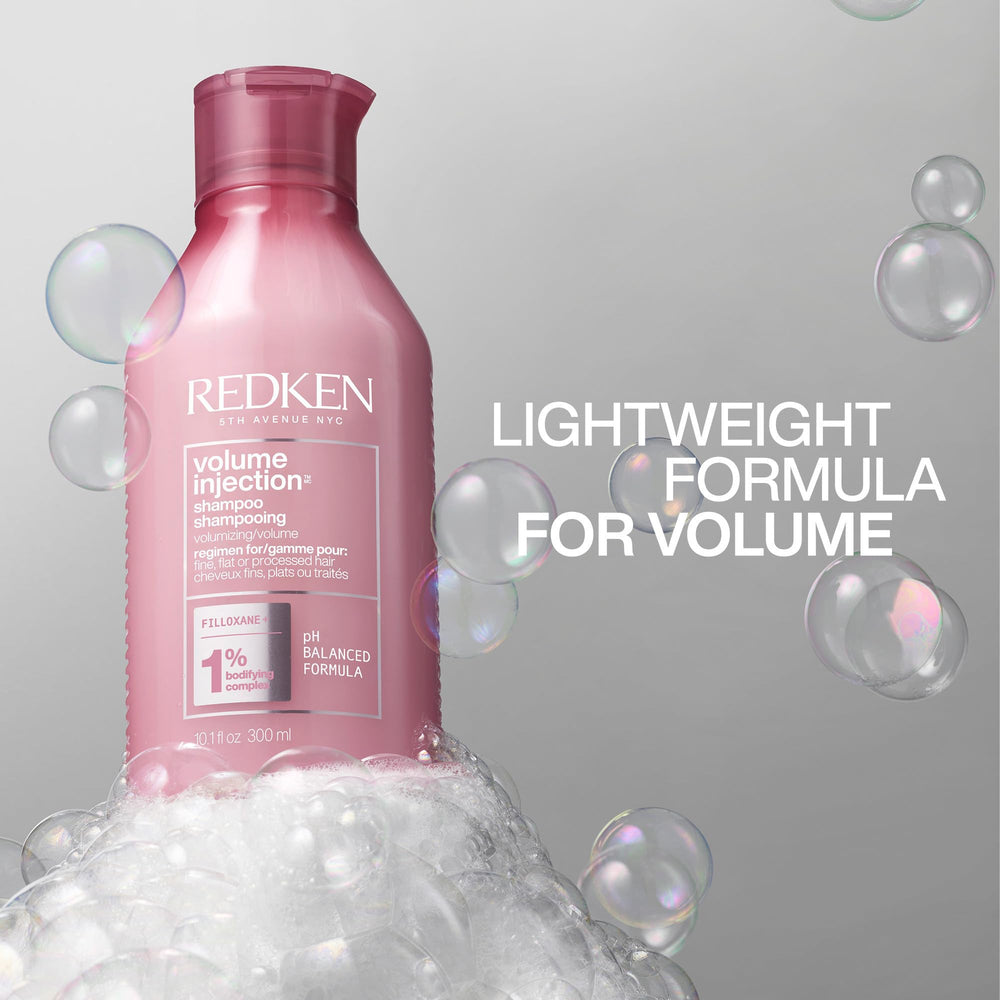 Redken envase junto a acondicionador para rutina completa de volumen