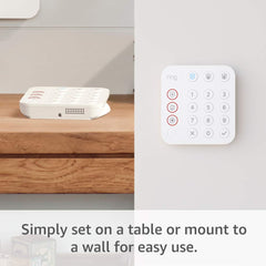Ring keypad in hand to show compact size and straightforward use
