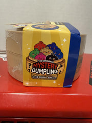 RMS Crazy Fun dumpling en mano para escala, demuestra tamaño 5 pulgadas y portabilidad