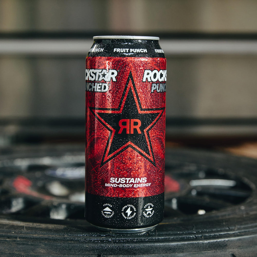 Rockstar can in hand showing 16 fl oz size and portable energy benefit