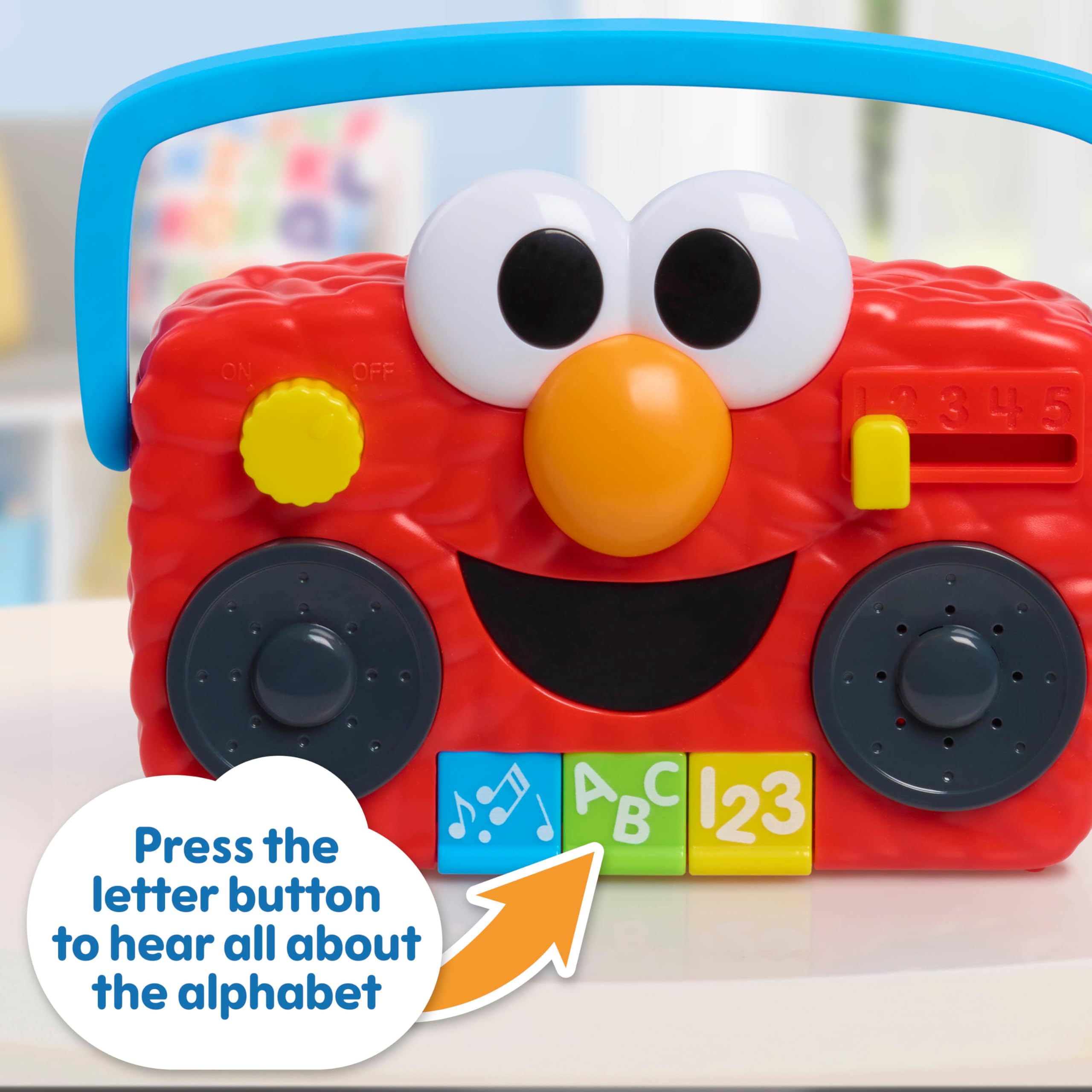 Sesame Street Elmo detalle de botones y deslizante para mejorar motricidad