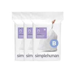 simplehuman paquete Code B mostrado de frente con dispensador visible y almacenamiento ordenado