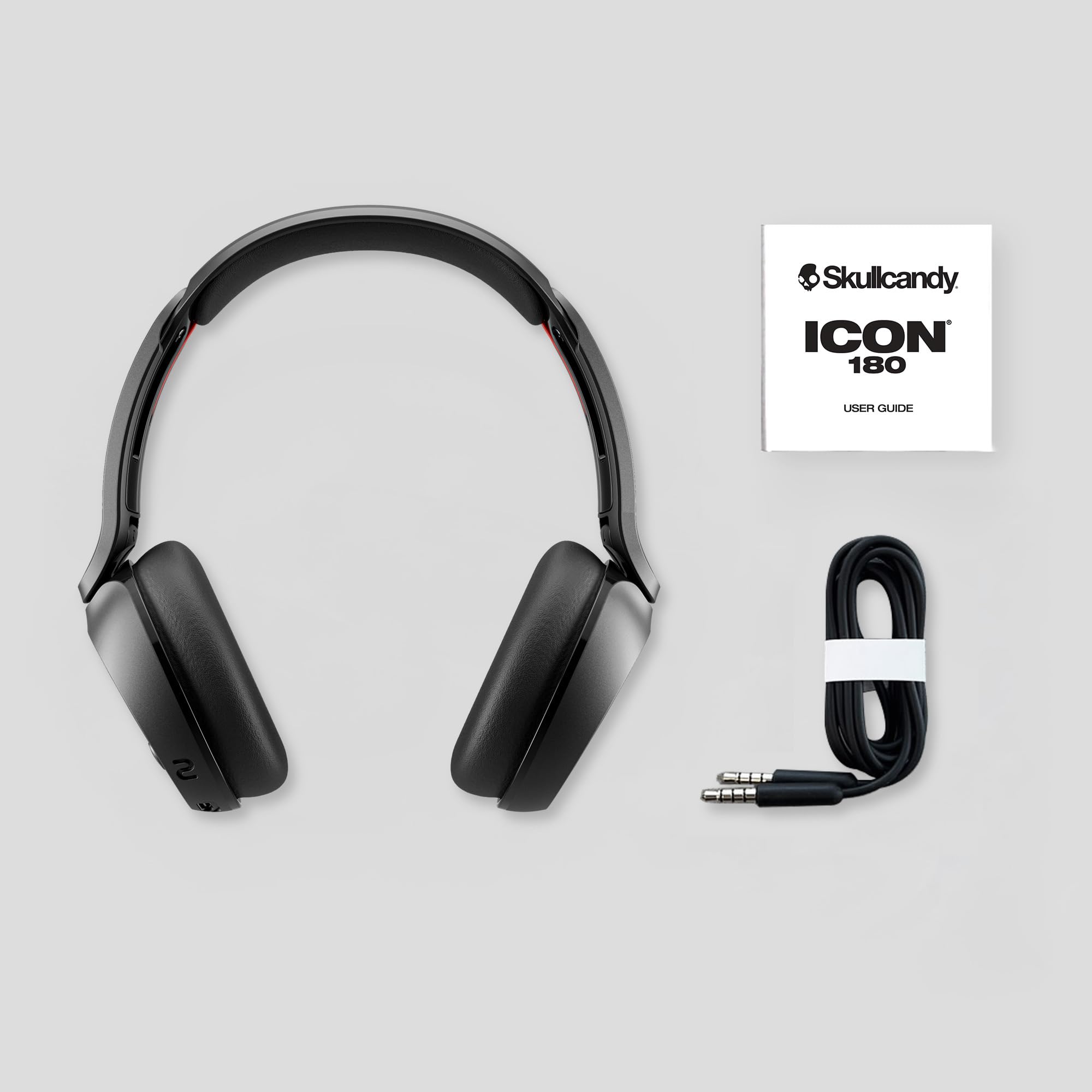 Close-up del puerto de carga y botones Skullcandy Icon 180 para control rápido
