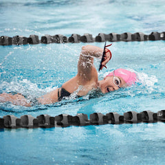 Swimmer wearing Speedo Vanquisher goggles in pool illustrating clear sightlines and secure fit