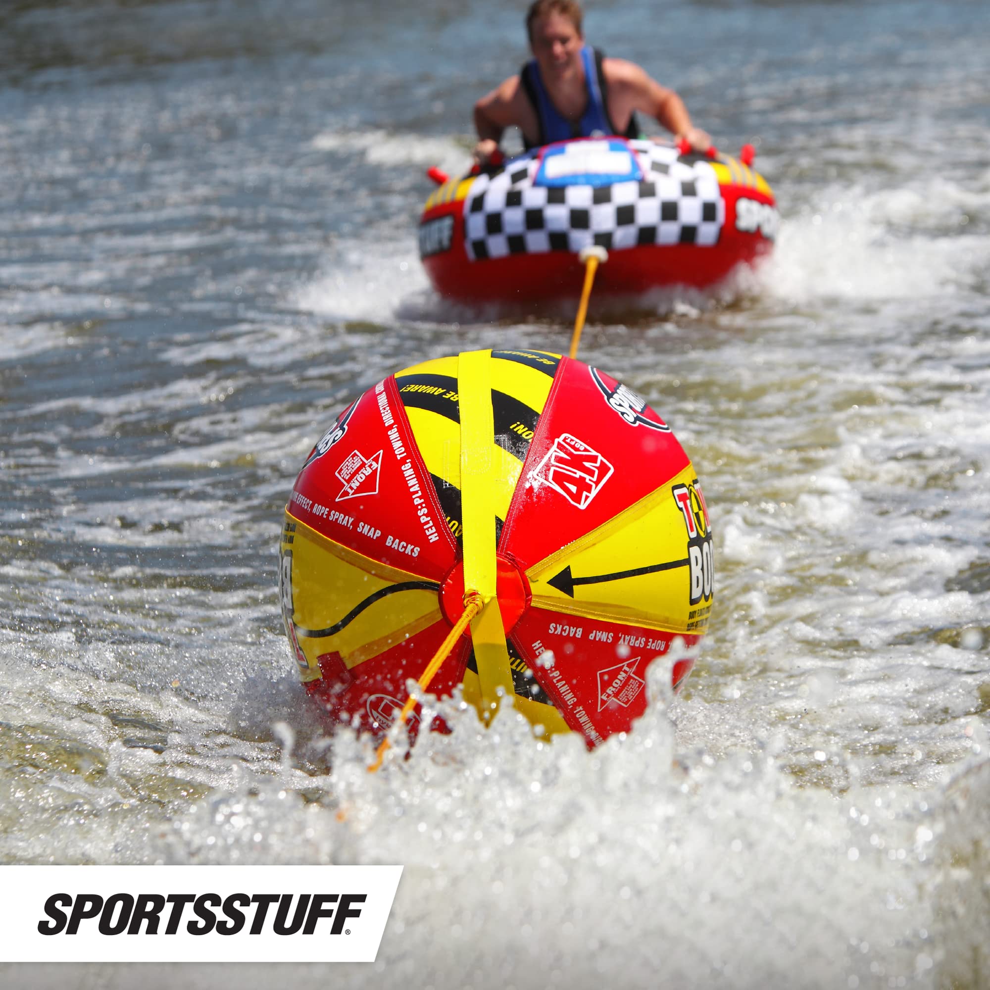 SportsStuff Booster Ball comparación de tamaño junto a una mano para escala