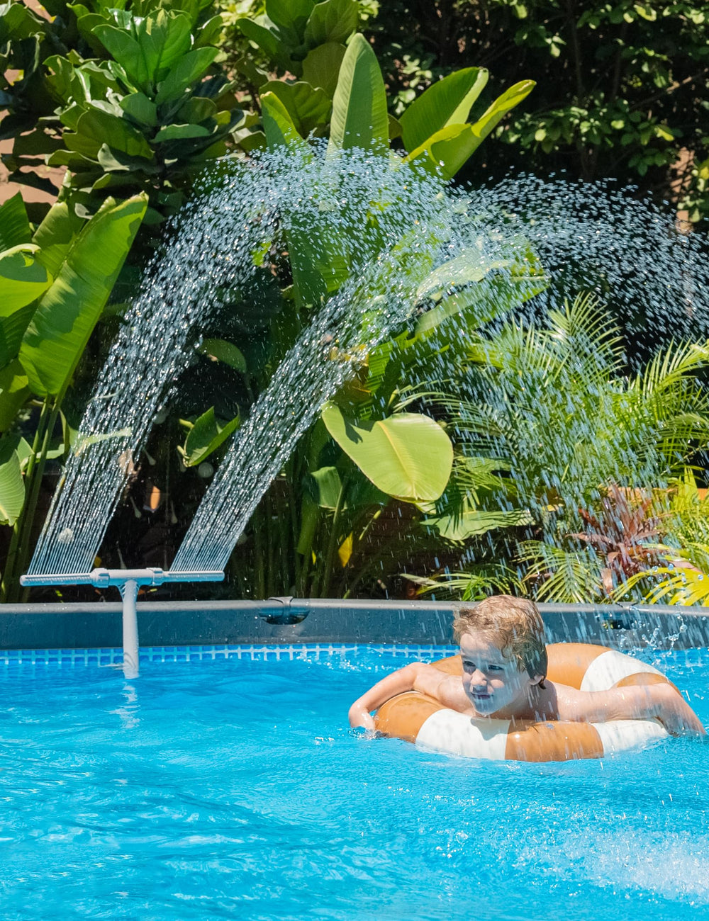 SUMMERBUDDY fountain held in hand showing compact size and easy handling