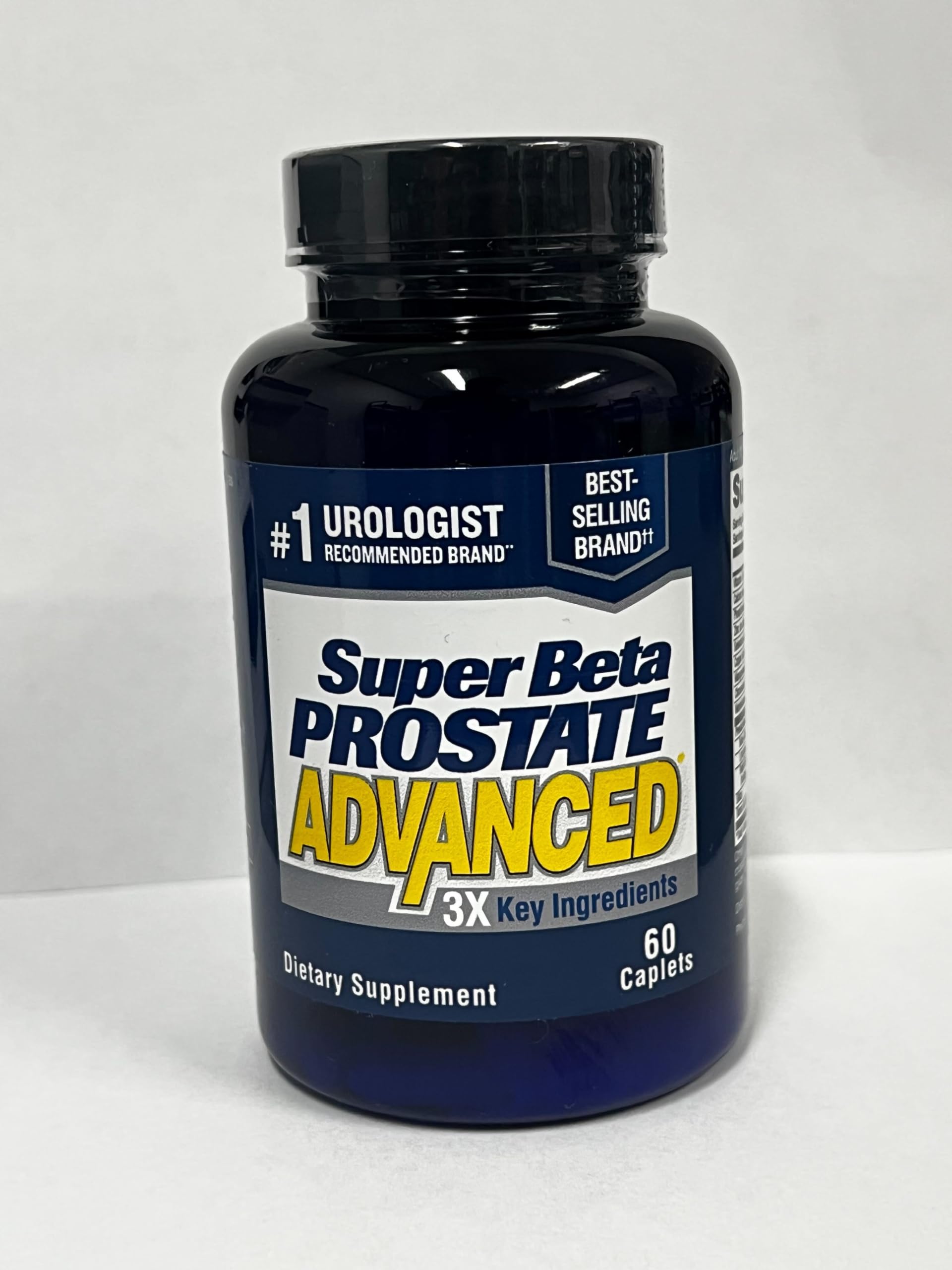 SUPER BETA PROSTATE cápsula comparada con monedas para escala clara