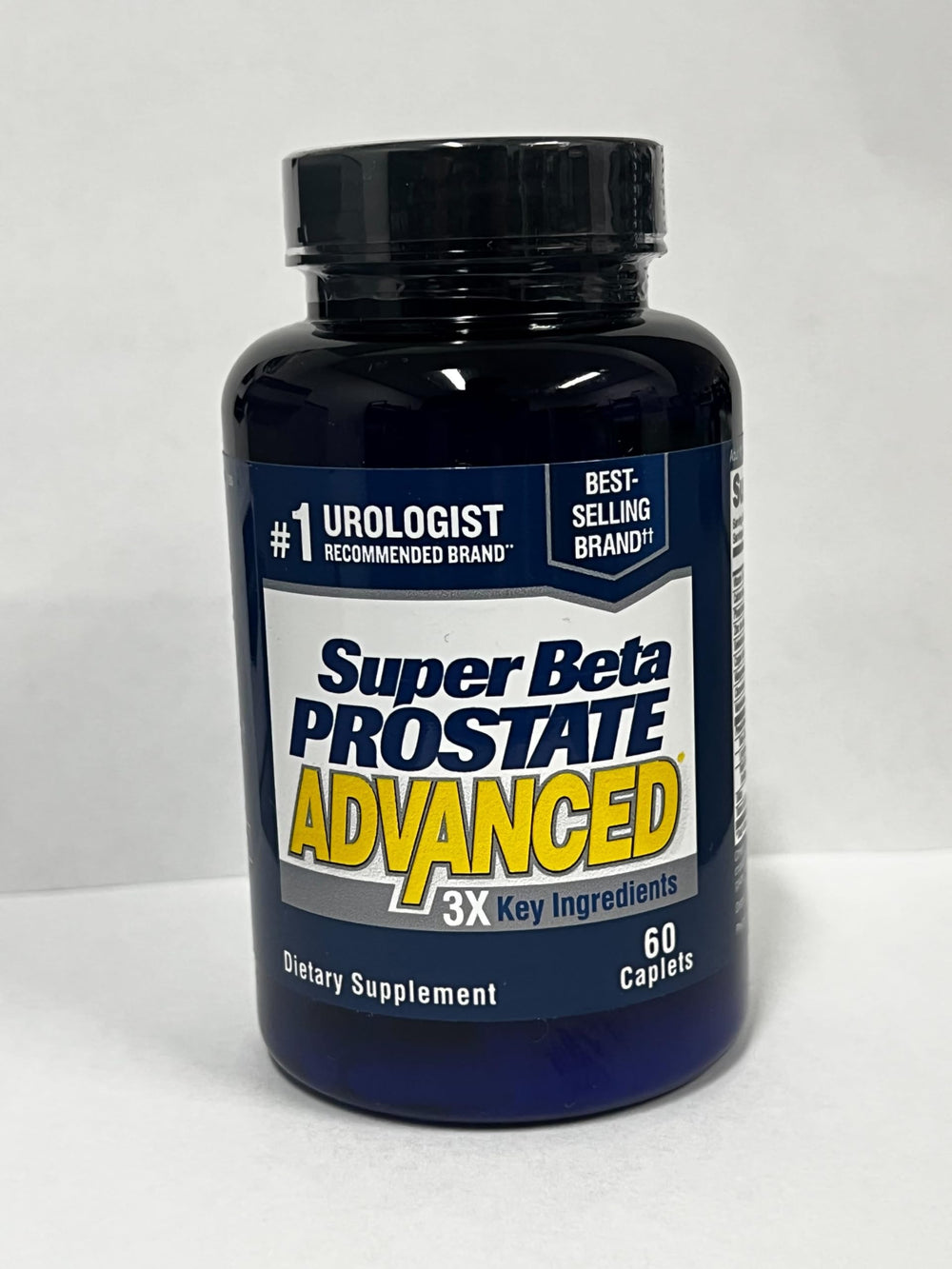 SUPER BETA PROSTATE cápsula comparada con monedas para escala clara