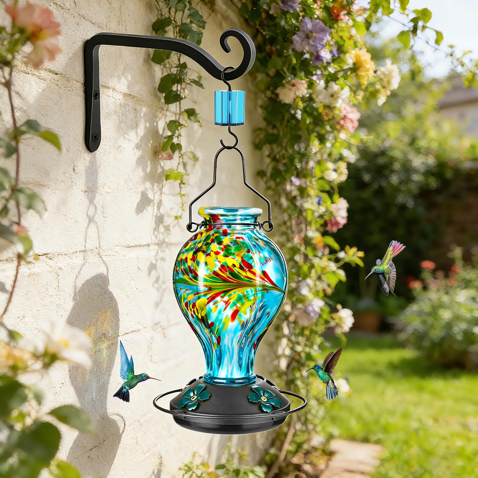 Tegarbed feeder hanging in garden adding color and drawing hummingbirds