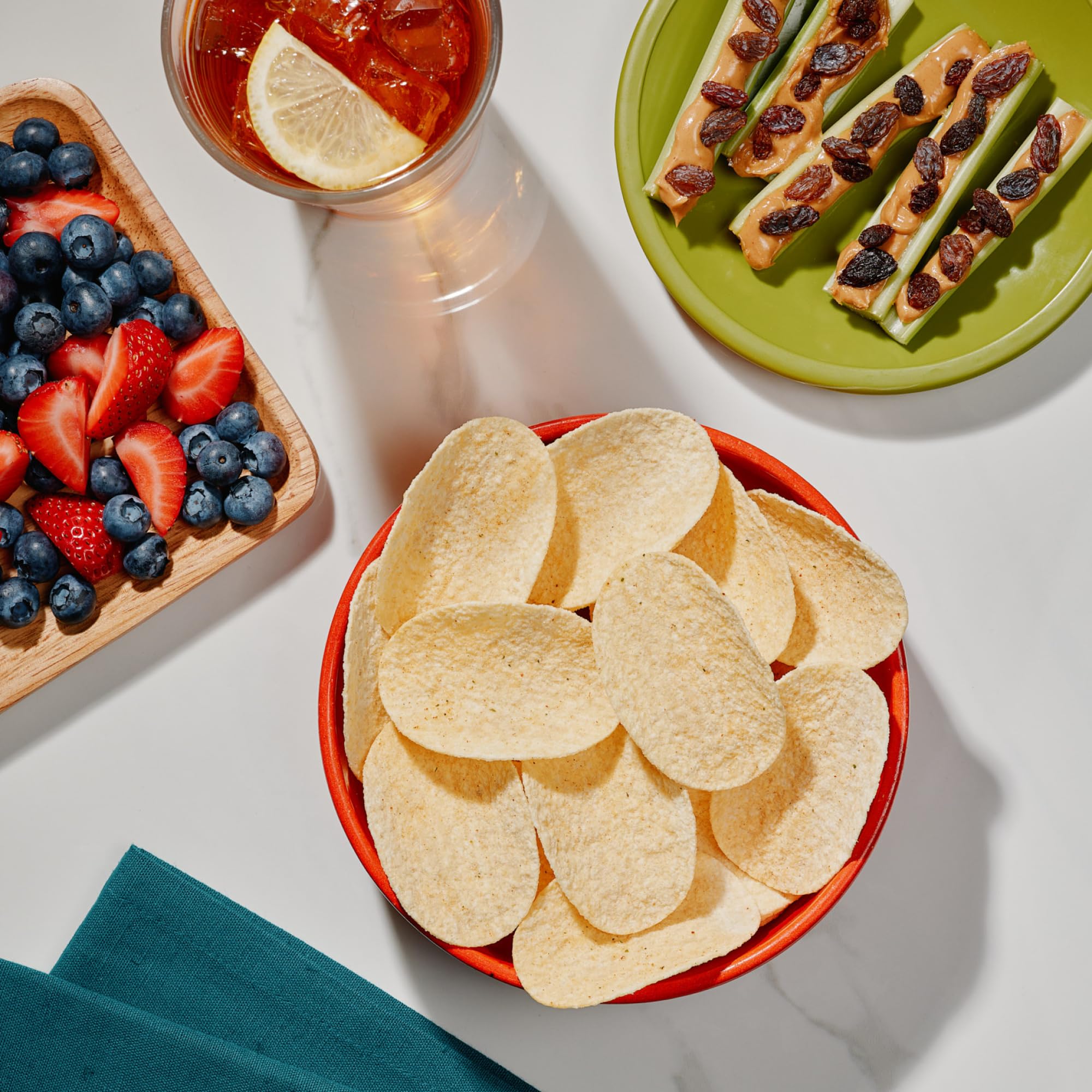 The Good Crisp Company stacked mini cans demonstrating portable portion control benefit