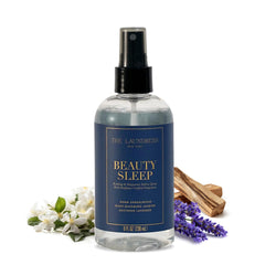The Laundress frasco frontal mostrando diseño elegante y beneficio aromático