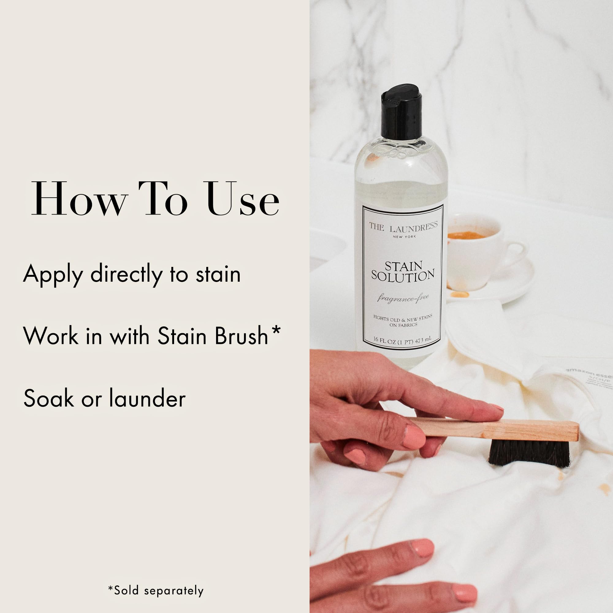 The Laundress botella en mano para escala, tamaño práctico de 473 ml