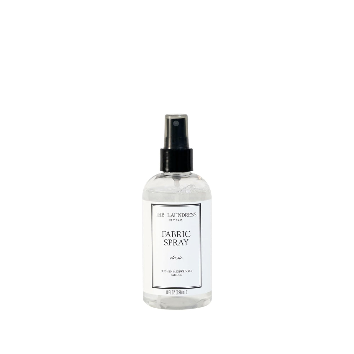 The Laundress spray frontal mostrando botella elegante y beneficio de frescura