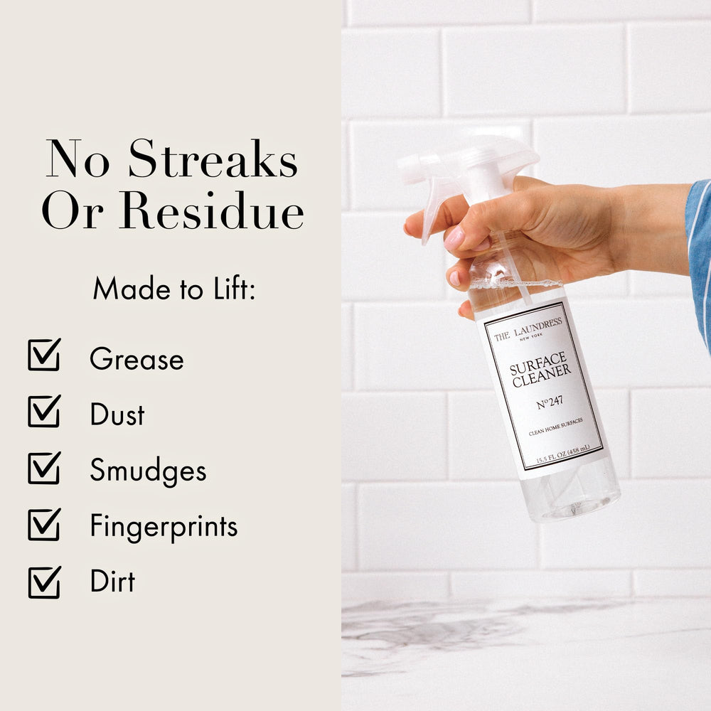 The Laundress Surface Cleaner comparado con una mano para mostrar tamaño 458 ml
