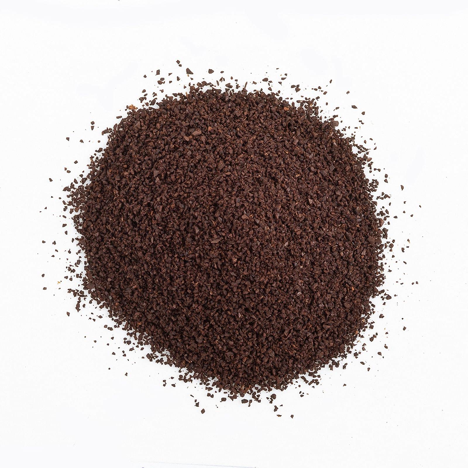 The Organic Coffee Co. cápsula junto a regla para comparar tamaño práctico
