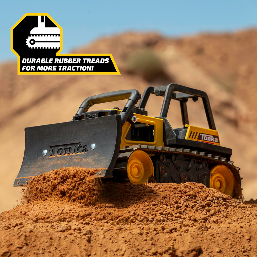 Tonka in sandbox use demonstrating hands-on digging fun and tactile learning benefit