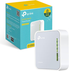 TP-Link TL-WR902AC vista frontal mostrando puertos y botones para configuración rápida