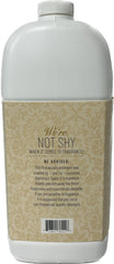 Botella de Glam Wash Diva de TYLER CANDLE COMPANY junto a una lavadora, uso práctico y aroma duradero