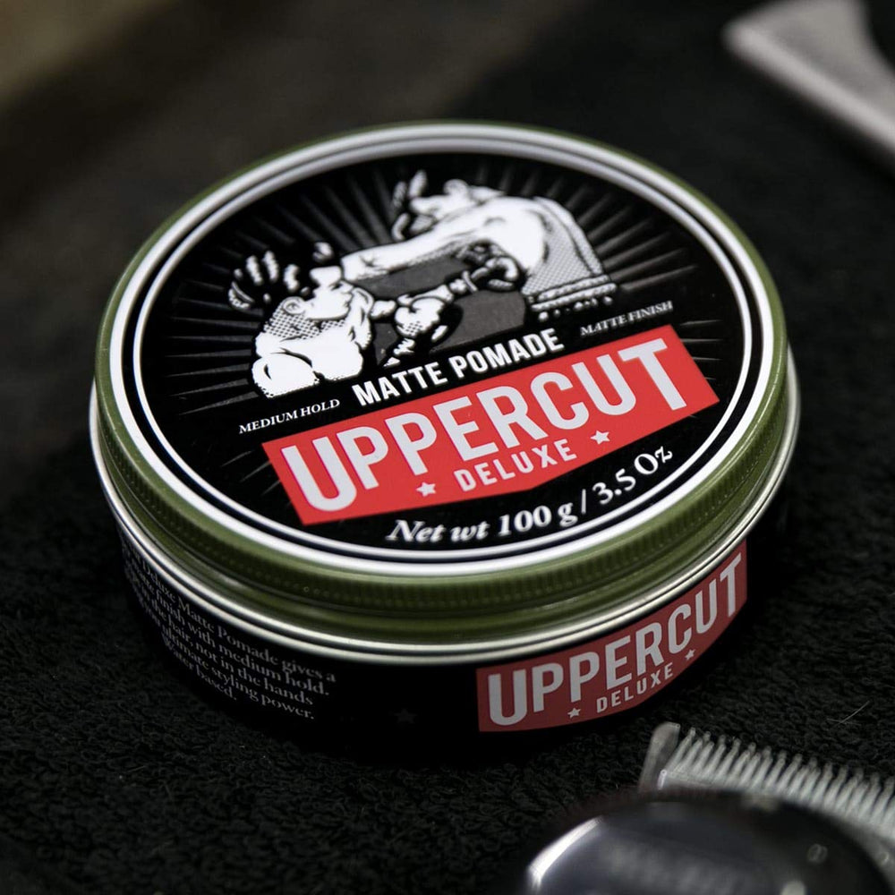 UPPERCUT DELUXE hands applying pomade for effortless styling control