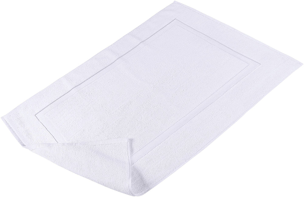 Utopia Towels ambientada en baño decorado, integra con estilo neutro