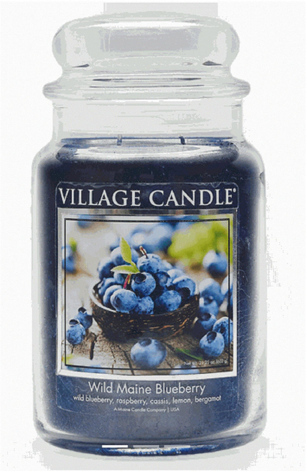 Village Candle vista frontal del tarro azul oscuro, presencia decorativa y aroma frutal