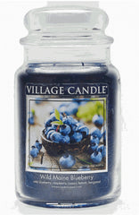 Village Candle vista frontal del tarro azul oscuro, presencia decorativa y aroma frutal