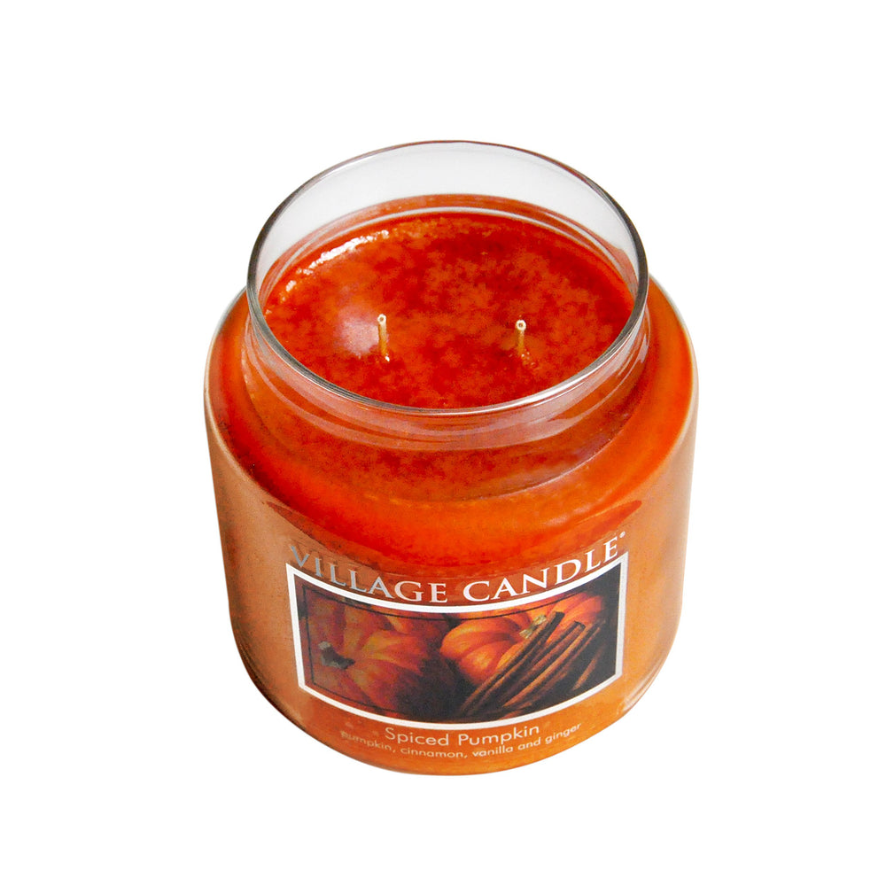 Village Candle spiced pumpkin lit in living room creating cozy seasonal atmosphere