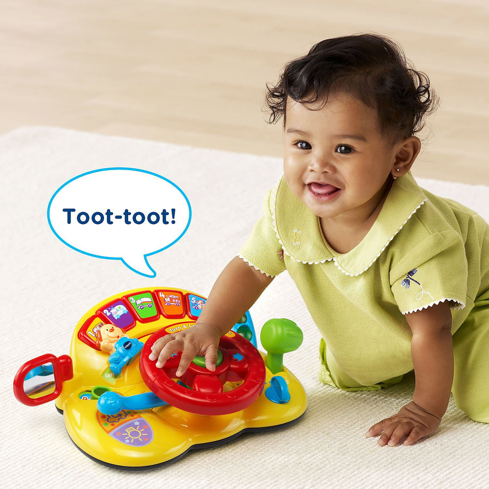VTech escena de juego infantil con el volante estimulando imaginación