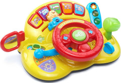VTech volante frontal amarillo mostrando luces y bocina para juego seguro