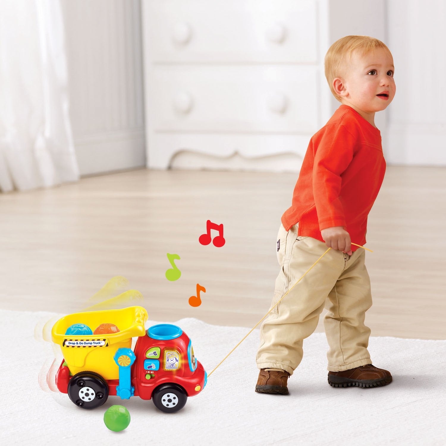 VTech juguete en uso por bebé fomentando motricidad y curiosidad