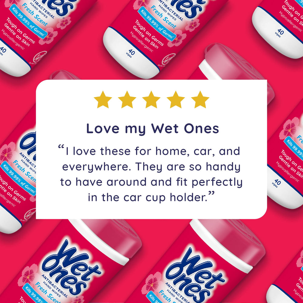 Wet Ones canister seated in car cupholder for easy travel convenience