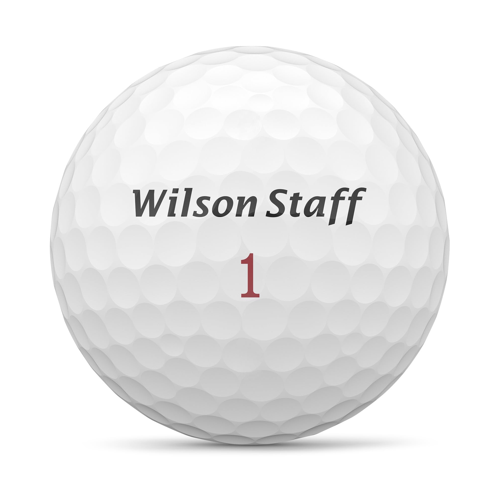 Wilson Staff Zip bola en césped destacando vuelo y beneficio de estabilidad