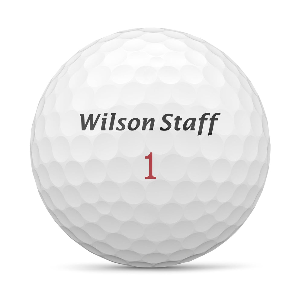 Wilson Staff Zip bola en césped destacando vuelo y beneficio de estabilidad