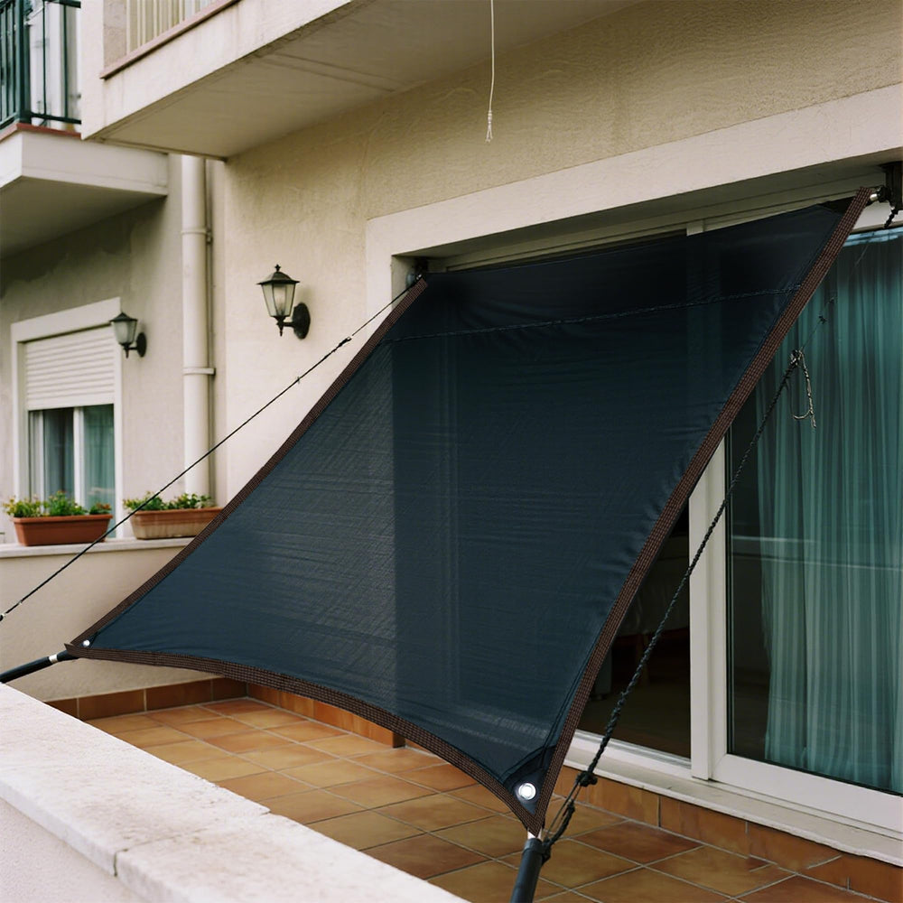 winemana covering garden beds to diffuse sunlight and protect seedlings
