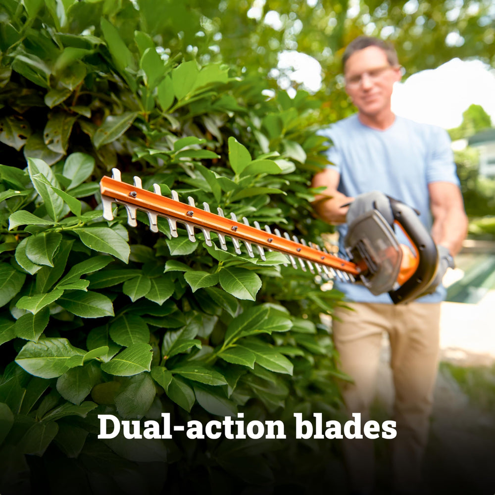 WORX trimmer in use overhead trimming hedges with lightweight maneuverability