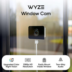 Wyze cámara montada en ventana reduciendo reflejos y ofreciendo vista exterior clara