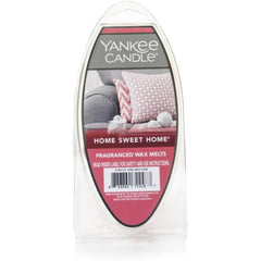 Pastilla Yankee Candle fundiéndose en warmer, distribuye aroma hogareño eficazmente