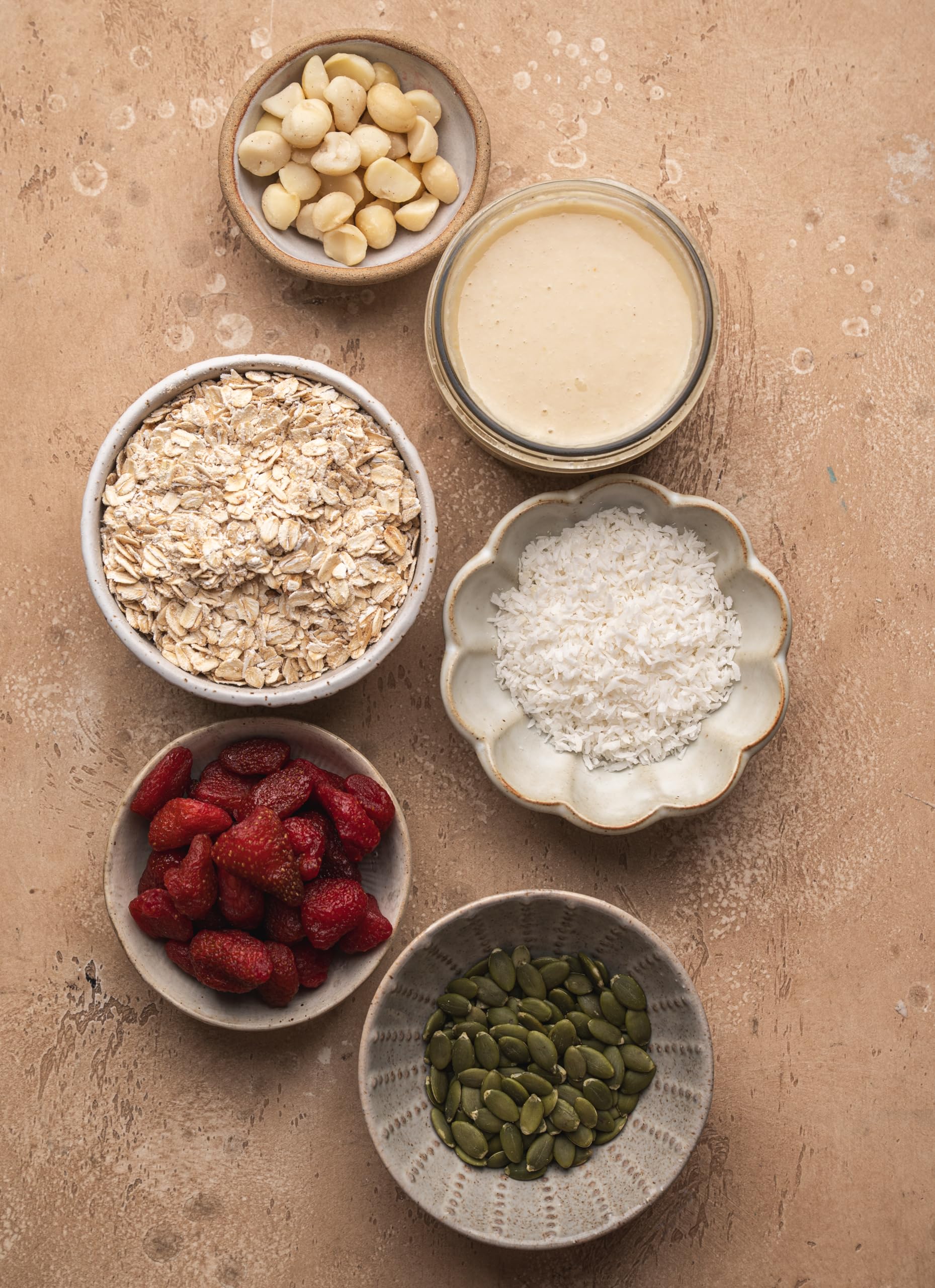 Yupik macadamia beside measuring cup for portion and scale clarity